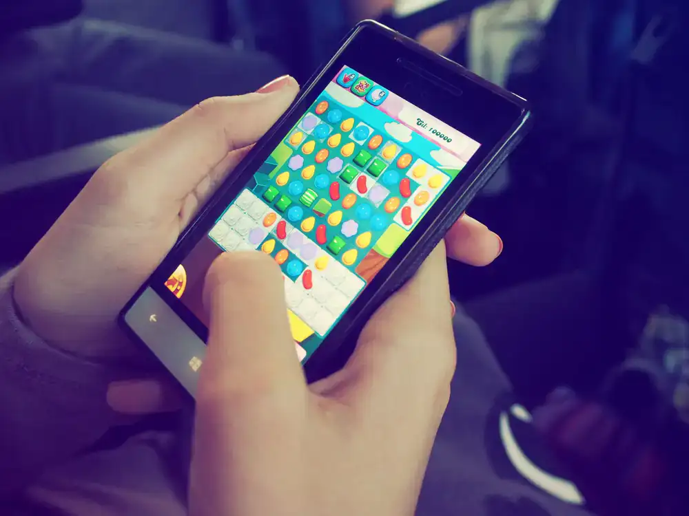 Gameplay screenshot showing a colorful crossword puzzle interface on a mobile device